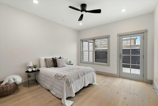 bedroom featuring baseboards, access to outside, recessed lighting, and light wood finished floors