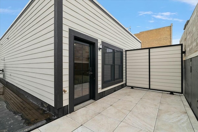 view of patio featuring fence