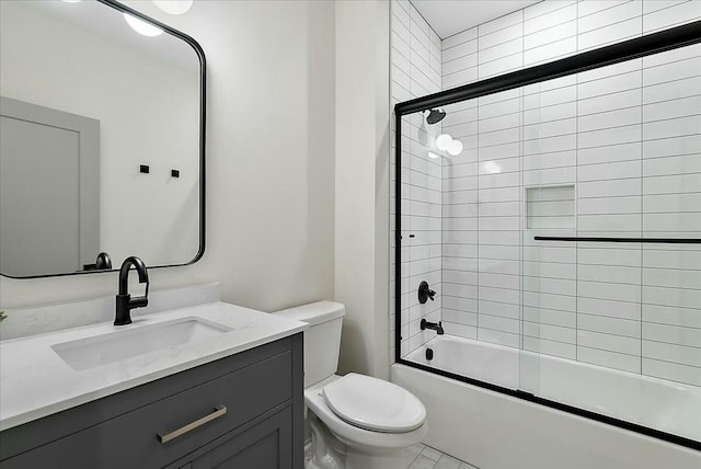 bathroom with shower / bath combination with glass door, toilet, and vanity