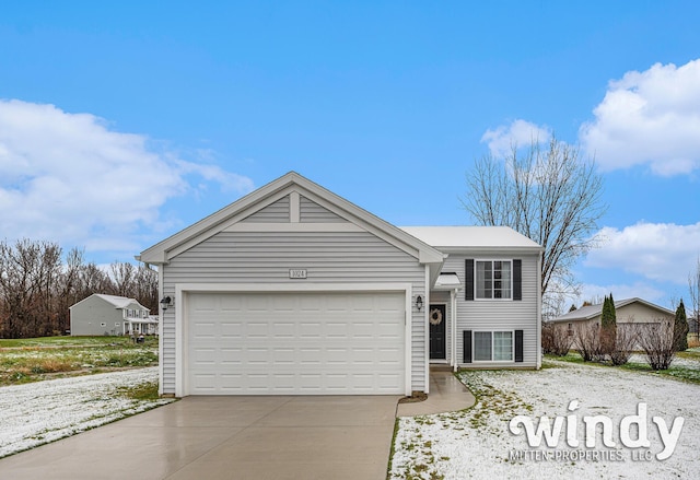 view of front of home featuring an attached garage and concrete driveway