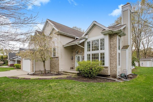 traditional-style home featuring an attached garage, brick siding, driveway, a chimney, and a front yard