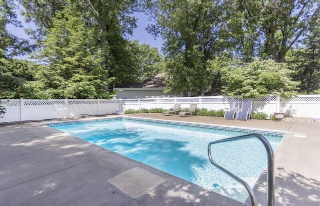 view of swimming pool featuring a fenced in pool, a patio area, and a fenced backyard