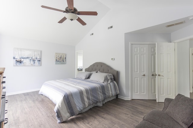 bedroom featuring ceiling fan, high vaulted ceiling, wood finished floors, visible vents, and a closet