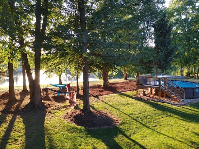 view of yard featuring an outdoor pool