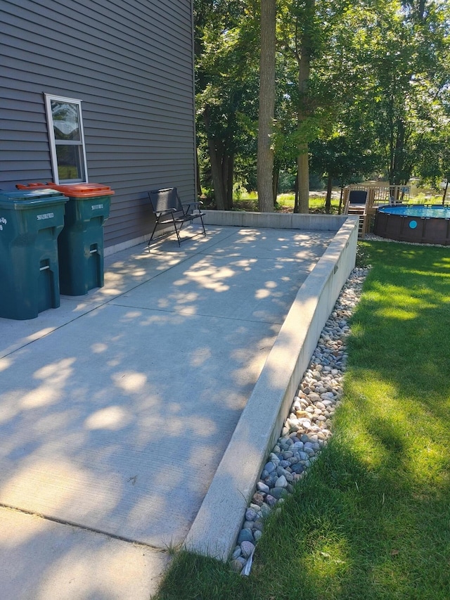 view of patio with an outdoor pool