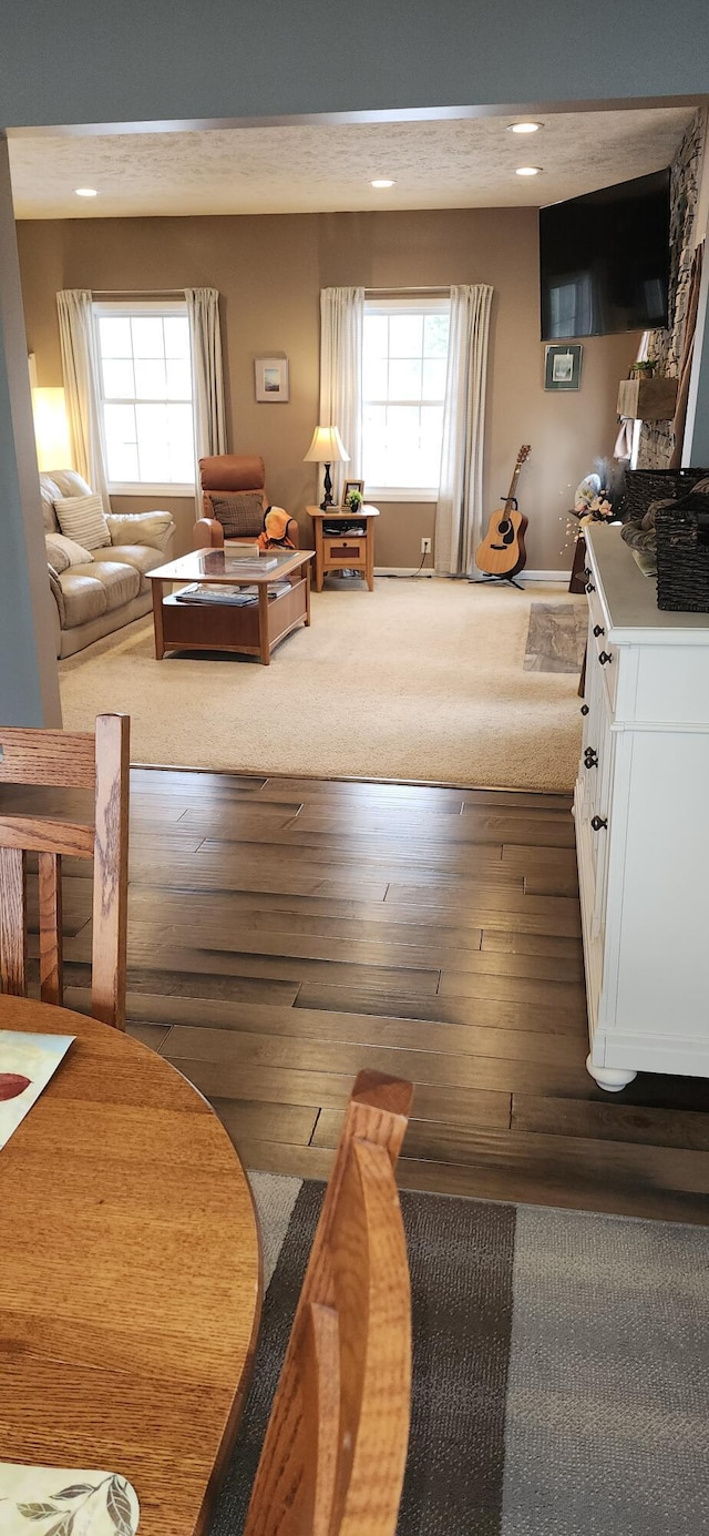 living room with hardwood / wood-style floors and recessed lighting