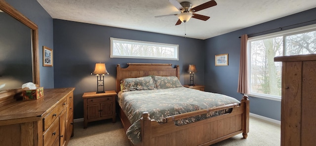 bedroom with multiple windows and light colored carpet