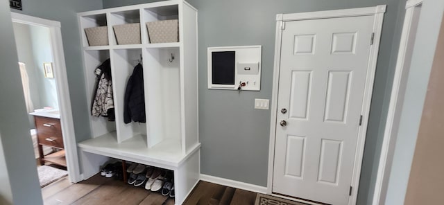 mudroom with baseboards and wood finished floors