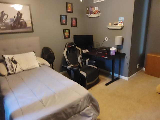 carpeted bedroom featuring visible vents and baseboards