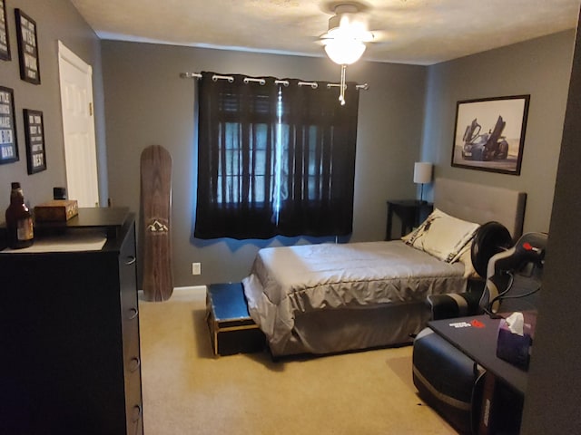 carpeted bedroom with a ceiling fan