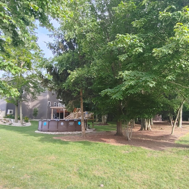 view of yard featuring an outdoor pool