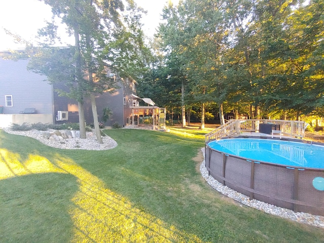 pool featuring a playground and a yard