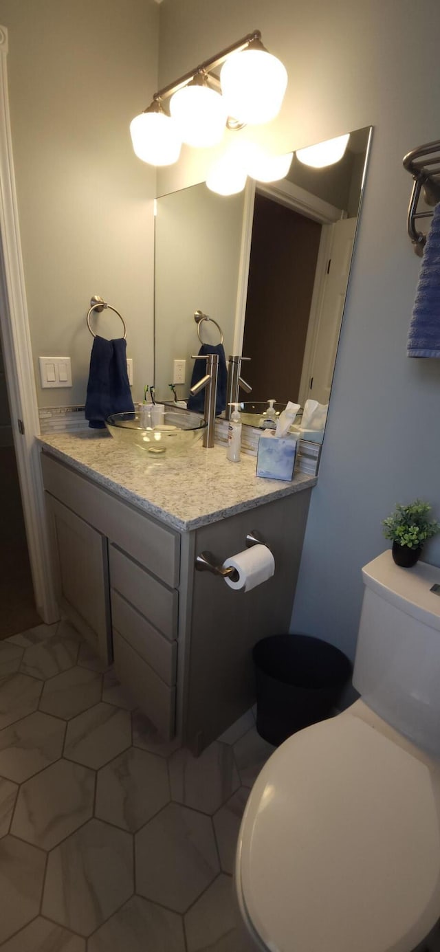 bathroom with vanity and toilet