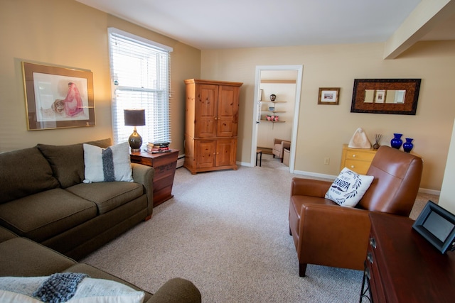 living room featuring a baseboard radiator, light carpet, and baseboards