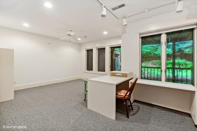 interior space with carpet floors, recessed lighting, rail lighting, ceiling fan, and baseboards