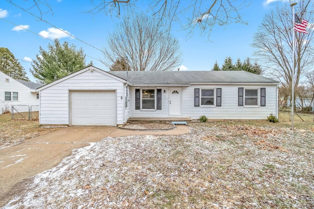 single story home with an attached garage, driveway, fence, and roof with shingles