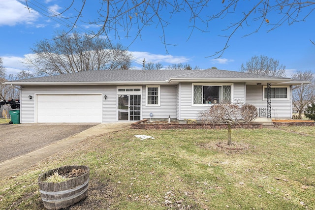 ranch-style house with a garage, a front yard, driveway, and a shingled roof