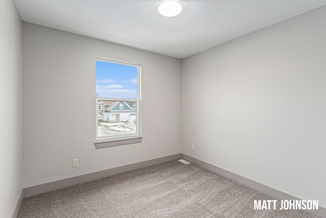 2105 Willard Ave SE, Grand Rapids, MI 49507 - carpeted empty room featuring baseboards