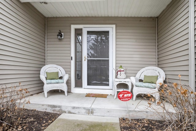 view of exterior entry with covered porch