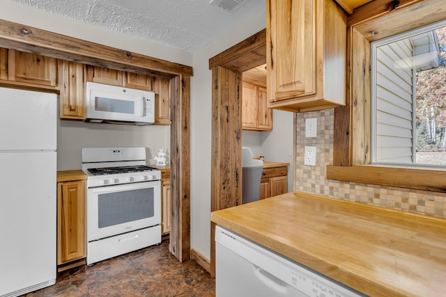 kitchen with tasteful backsplash, visible vents, a textured ceiling, butcher block countertops, and white appliances