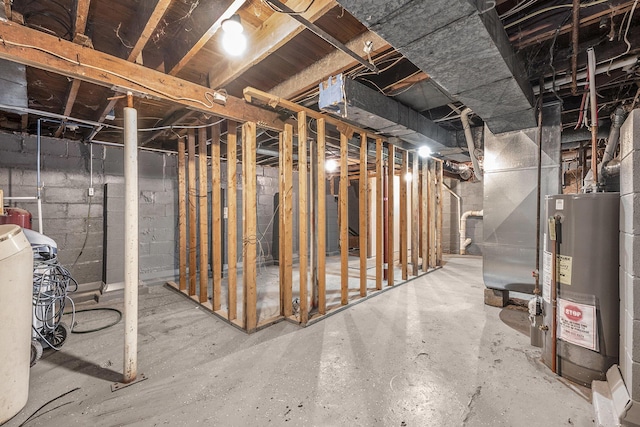 unfinished basement featuring gas water heater and heating unit