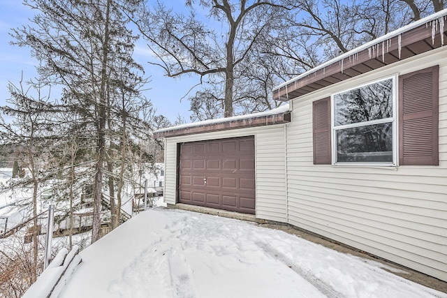 view of snow covered garage