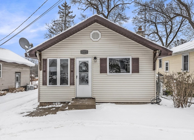 view of front of home with a chimney