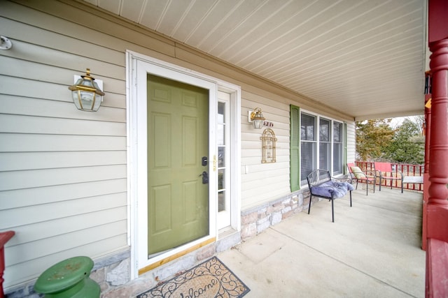 property entrance featuring covered porch