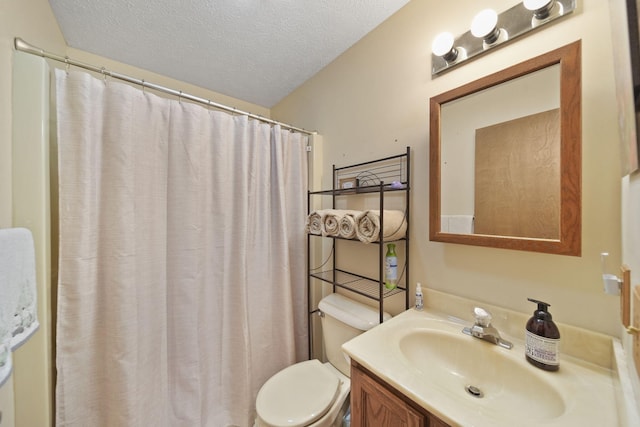 bathroom with a textured ceiling, toilet, vanity, and a shower with curtain