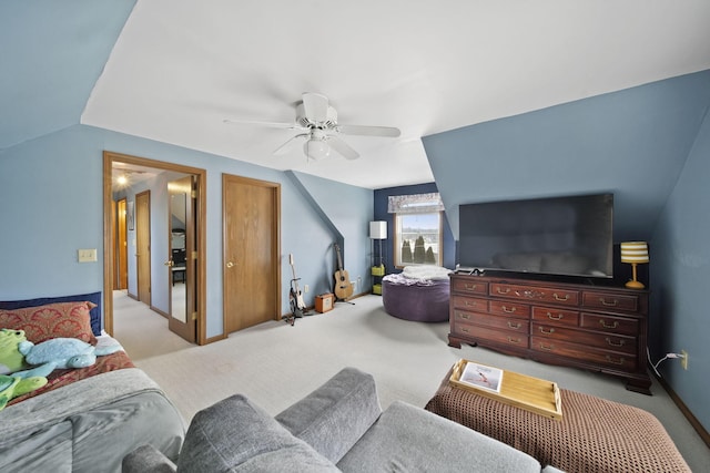 living room featuring light carpet, vaulted ceiling, a ceiling fan, and baseboards