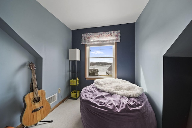 carpeted bedroom with visible vents and baseboards