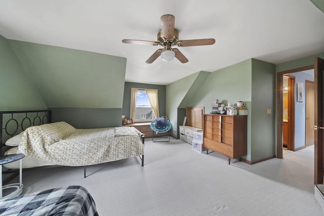 bedroom featuring vaulted ceiling, carpet flooring, ceiling fan, and baseboards