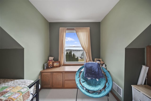 bedroom featuring light carpet and visible vents