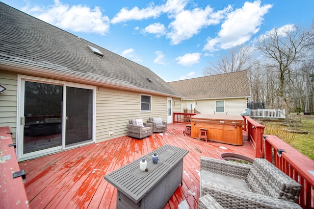 deck featuring a hot tub