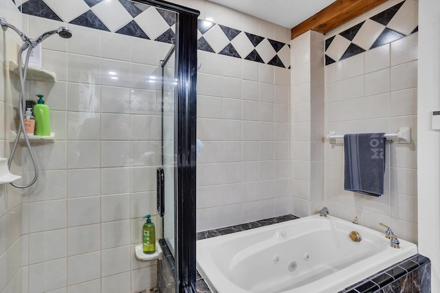 bathroom with a tub with jets, tiled shower, beamed ceiling, and tile walls