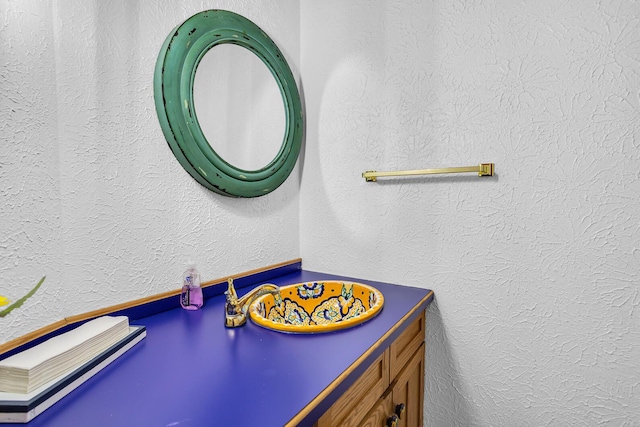 bathroom with a textured wall