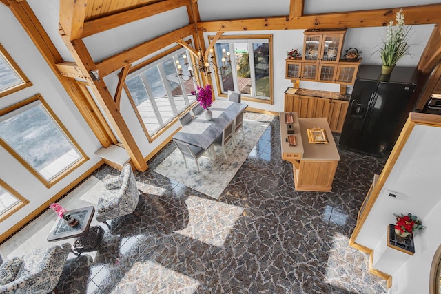 living room with a chandelier and marble finish floor