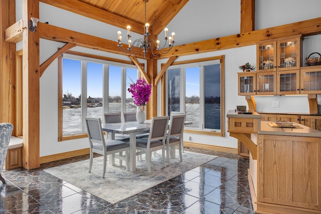 dining room with lofted ceiling, a notable chandelier, wood ceiling, baseboards, and marble finish floor