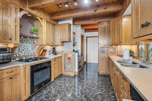 kitchen with wooden ceiling, a sink, light countertops, decorative backsplash, and black appliances