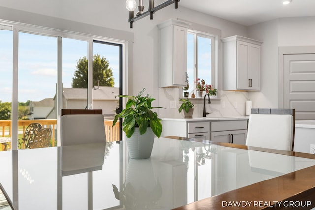 dining space featuring recessed lighting