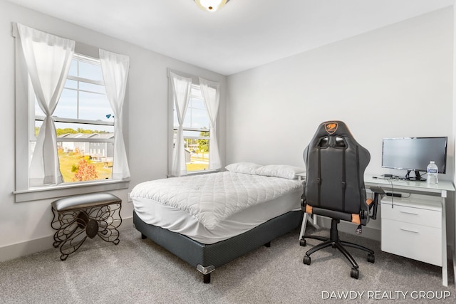 carpeted bedroom with baseboards