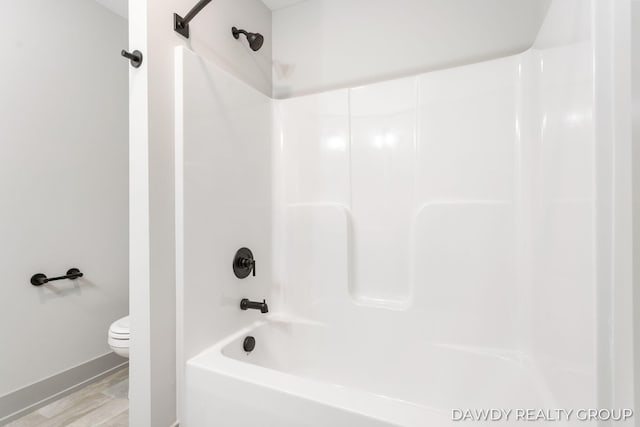 full bath featuring toilet and wood finished floors