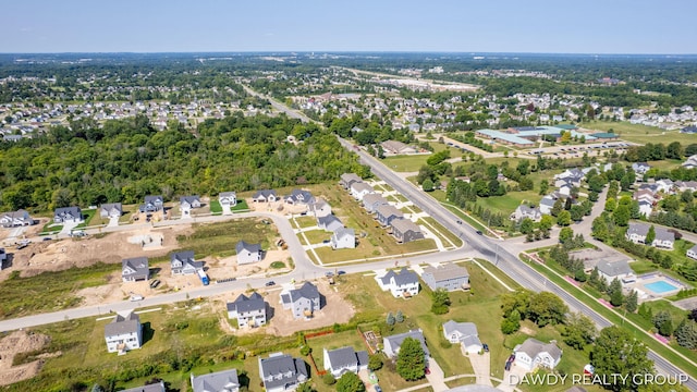 birds eye view of property with a residential view