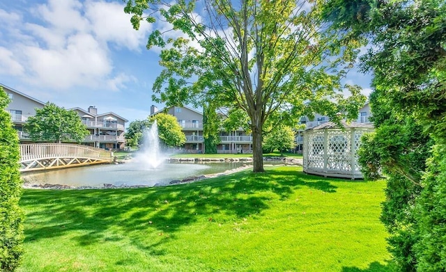 21082 Boulder Cir, Northville, MI 48167 - view of property's community featuring a lawn and a water view