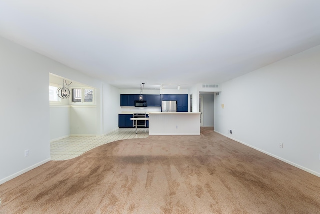 21082 Boulder Cir, Northville, MI 48167 - unfurnished living room with rail lighting, light tile patterned floors, baseboards, visible vents, and light carpet