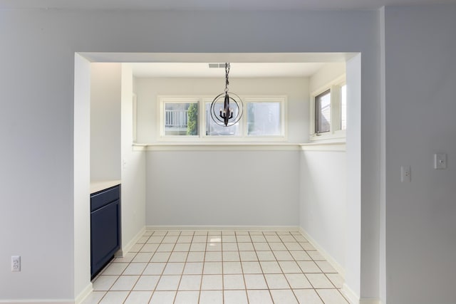 21082 Boulder Cir, Northville, MI 48167 - unfurnished dining area with baseboards, visible vents, a chandelier, and light tile patterned floors