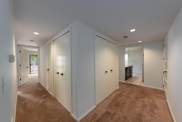 21082 Boulder Cir, Northville, MI 48167 - hall featuring recessed lighting, light carpet, baseboards, and visible vents