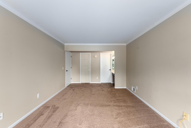 21082 Boulder Cir, Northville, MI 48167 - carpeted spare room featuring baseboards, visible vents, and crown molding