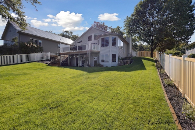 back of house featuring a fenced backyard, stairway, a deck, and a yard