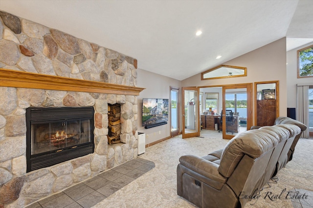 living area with french doors, a stone fireplace, plenty of natural light, and baseboards